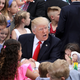 President Donald Trump sits at the kids’ craft table during the 139th Easter Egg Roll at the White House on April 17, 2017 (Photo by Chip Somodevilla/Getty Images)